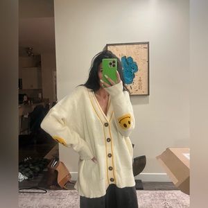 Dressed in Lala smiley face cardigan